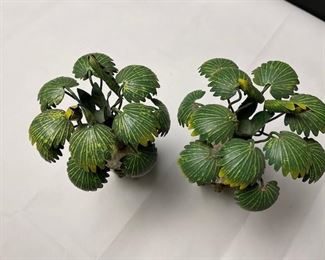 Tree candlesticks set in classical planter style bases with lion head ring handles, white stones, and ball feet.  Unknown origin