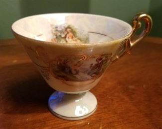 Vintage hand painted cup and saucer