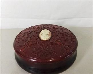 Plastic Ruby Red Avon Container with Intricate Detailing on Lid
