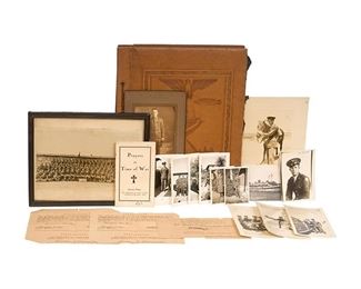 Leather bound embossed scrapbook with photographs of a soldier, his family, and some pictures from Europe during WWII.