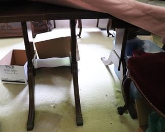 Legs of antique cherry table that seats 10.