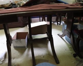 Legs of the cherry dining room table that seats 10