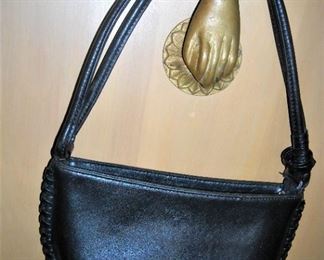 Black leather handbag by Prada