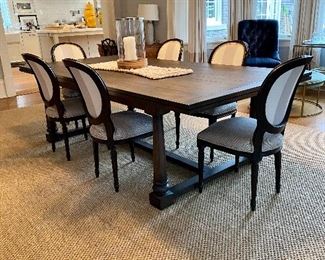 Set of six Lee Ind. designer dining chairs around an oversized farmhouse dining table.