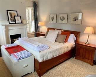 Orange furniture king bed and two bedside cabinets.