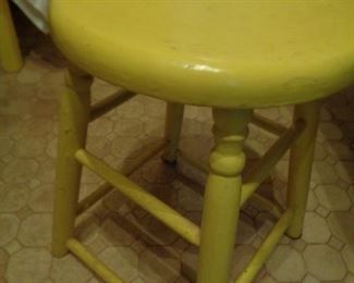 painted wooden stool, one of two