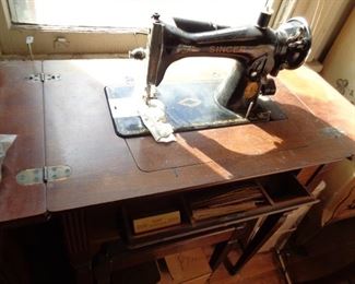 Antique Singer sewing machine in wooden table