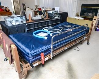 Invacare hospital bed with mattress and rails