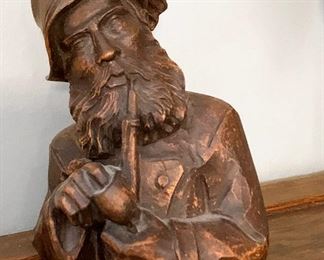 298. man with pipe sculpture