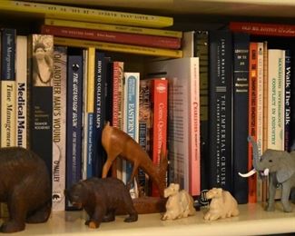 412. A wide assortments of books, some collections, and various animal figurines