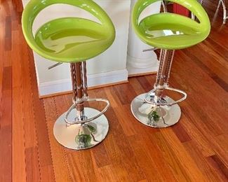$160 - Pair of lime green bar stools; adjustable height x 15" diameter base, (seat height at highest is 38")