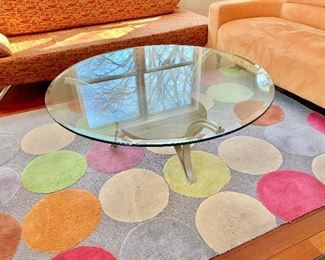 $240 - Modern round coffee table with glass top; 18.5" H x 44" diameter