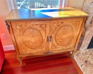 $495 - Inlaid sideboard with medallion doors and mirrored back, missing interior shelf. 36" H x 42.5" W x 16" D. No losses to the veneer, painted around the edge at the top, some nicks and scuffs, ornaments missing on front feet.