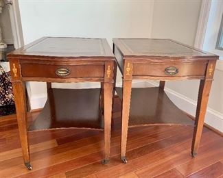 $300 - Pair of vintage leather topped side tables with drawers and small caster wheels; 24" H x 17.5" W x 27" D
