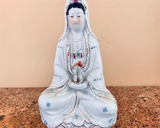 $20 - Ceramic figurine of a seated woman; 8.5" H x 4.5" W