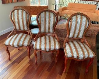 $600 - Four vintage dining chairs with upholstered seats and nailhead trim; 41" H x 20" W x 18" D, seat height is approximately 18.5" 