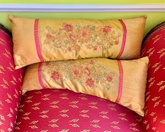$45 - Pair of gold and pink silk beaded pillows; 22" x 8"