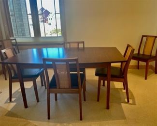 $400.00.....................MCM Table 64" x 42", 28 1/2" tall, includes 2 20" Leaves, Pads for all and 6 Chairs (S114)