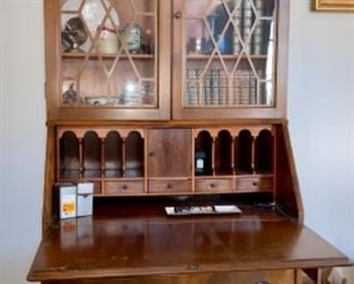 Lot 6002 $395.00 Antique Secretary with Glass Doors and Opens to Desk with Cubbies. Very Sweet - if there is a manufacturer's name, perhaps it's on the back. 78" H x 32" W x 16" D