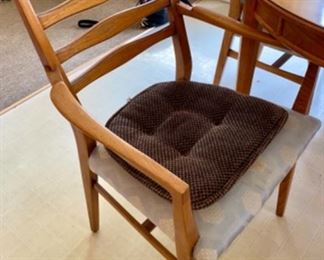 Lot 6003 $400.00. MCM Heritage Oval Dining Table with 6 Chairs (4 side and 2 armchairs). Includes: 2 Leaves each 18"w. Beautiful wood, appears to be Cherry or Pecan? Awesome inlay looking design. 6 Chairs, 58"x45" without leaves in. Chairs need new coverings,