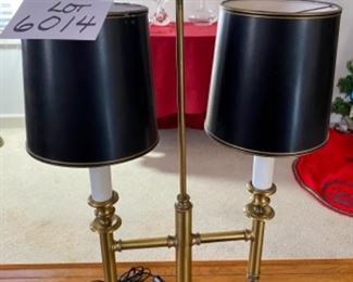 Lot 6014. $80.00. In the style of a Chapman Lamp, 2 light brass fixtures with black shades, 16" x 30.5" t x 7"dia shade, 6" square base. Unmarked. The shades are not in perfect shape, but the lamp makes a statement!