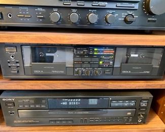 Lot 6025. $175.00 ( 0ver $360.00 if bought individually) 4 Tier Stereo Component Cabinet with Glass Doors ($110.00), 1988 Yamaha KX-W302U Double Cassette Deck (eBay 79.95 Sold Price) 1990 Yamaha RX-530 Natural Sound Stereo Receiver ($72.00 eBay Sold Price), Sony 5-Disc Player CDP-C545 ($75.00 eBay Sold Price), Pair of Boston A70 Speakers with Stands. ($30.00 eBay Sold Price)