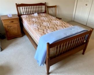 Lot 6036. $150.00. Pair of Twin Beds with spindle head and footboards and rails with mattresses and box springs. Headboards: 42"w x 38.5"t & Footboard: 42"w x 27.5"t. The matching bed is in storage in the basement and in great condition. Not sure about these mattresses - we did not test them out!