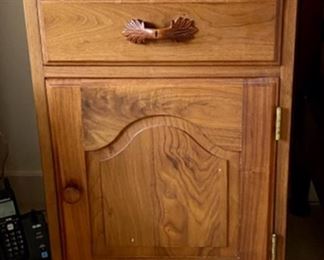 Lot 6038. $75.00 Hand-crafted Amish Made Side table, Krauss Furniture Shop. South Amana, IA. Crafted of walnut w/one drawer and one door. Has issues but could be transformed into quite a piece. Well-Made. 18"w x 17"d x 26"h