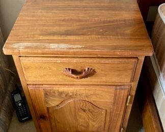 Lot 6038. $75.00 Hand-crafted Amish Made Side table, Krauss Furniture Shop. South Amana, IA. Crafted of walnut w/one drawer and one door. Has issues but could be transformed into quite a piece. Well-Made. 18"w x 17"d x 26"h