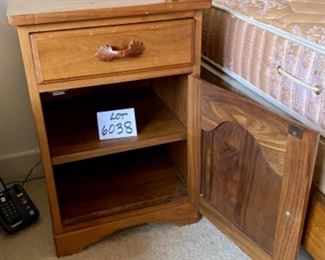 Lot 6038. $75.00 Hand-crafted Amish Made Side table, Krauss Furniture Shop. South Amana, IA. Crafted of walnut w/one drawer and one cabinet. Has issues but could be transformed into quite a piece. Well-Made. 18"w x 17"d x 26"h