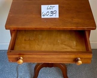 Lot 6039. $300.00. Vintage pair of side tables on a pedestal with one drawer. 3 legged pedestal with the turned wood leg. The drawer is dovetailed. These two are just stunning, heirloom quality. 20"w x 16"d x 27.5"h