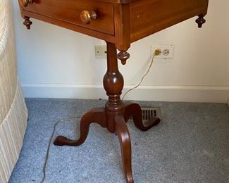Lot 6039. $300.00. Vintage pair of side tables on a pedestal with one drawer. 3 legged pedestal with the turned wood leg. The drawer is dovetailed. These two are just stunning, heirloom quality. 20"w x 16"d x 27.5"h