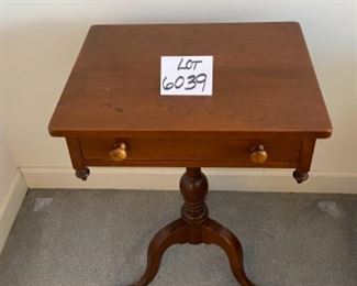 Lot 6039. $300.00. Vintage pair of side tables on a pedestal with one drawer. 3 legged pedestal with the turned wood leg. The drawer is dovetailed. These two are just stunning, heirloom quality. 20"w x 16"d x 27.5"h