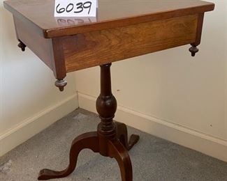 Lot 6039. $300.00. Vintage pair of side tables on a pedestal with one drawer. 3 legged pedestal with the turned wood leg. The drawer is dovetailed. These two are just stunning, heirloom quality. 20"w x 16"d x 27.5"h