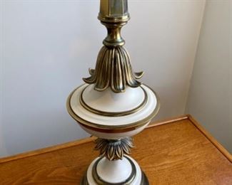 Lot 6051. $65.00. Mid-Century White and Brass Table Lamp. 38"tall. The shade is rough and needs to be replaced or used without. We have 2 of these lamps, the other is in Lot 6153.