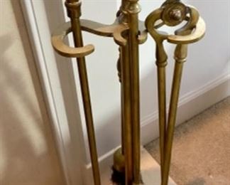 Lot 6054. $50.00 Brass 5 pc, tool set. 26" tall, 9" w, half moon shape. Also Brass Fireplace Log Holder 25.5" long x 15" wide