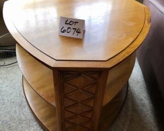 Lot 6074. $150.00. Heritage Side Table Rounded Tri "as is" with 2 shelves, Needs work - dog damage 29.5x 31" 23" tall. Good bones and worth painting or restoring.