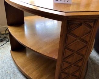 Lot 6074. $150.00. Heritage Side Table Rounded Tri "as is" with 2 shelves, Needs work - dog damage 29.5x 31" 23" tall. Good bones and worth painting or restoring.