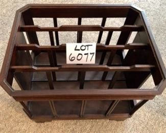 Lot 6077. $55.00 4 Section Magazine Rack with Moveable Convenience Tray, Brass Handle Detail. Measures 15"w x 19"deep x13" tall. Not branded. So handy, and the tray allows this to hold drinks, remotes, etc. while you pick your poison to read magazines, do your taxes, work from home, etc. Neat piece