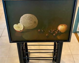 Lot 6078. $250.00. Set of 4 vintage tray tables from 1950's . Each tray has a different lacquered fruit design. Painted all black except the tray. By Artex Tables. c.
1950s MCM. Ok, gang - these are about the coolest TV tables we've ever seen - besides being works of art, they are clever anytime you need an extra table - use for puzzles, eating away from your table, helping organize your work from home mess, and more. Form & function, my mantra these days!