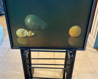 Lot 6078. $250.00. Set of 4 vintage tray tables from 1950's . Each tray has a different lacquered fruit design. Painted all black except the tray. By Artex Tables. c.
1950s MCM. Ok, gang - these are about the coolest TV tables we've ever seen - besides being works of art, they are clever anytime you need an extra table - use for puzzles, eating away from your table, helping organize your work from home mess, and more. Form & function, my mantra these days!
