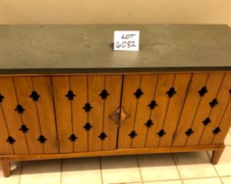 Lot 6082. $265.00 Media console Mid Century Bi-Fold doors with Keyhole Cut Outs. The top is a solid piece of slate that needs a good cleaning and sealing. 45"w x 15.5 deep x 25" high. This is a terrific credenza/console, with folding doors and a thousand uses, eclectic but with a definite Mid Century appeal.