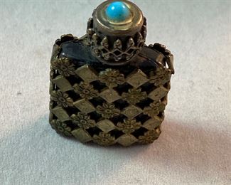 Lot 6099. $75.00 Ross Spangler Blue bowl (6"d x 3.25"t) signed by artist 1993, a cute chickadee pottery bowl (5"dia x 2.75"t), mini filigree perfume bottle Made in France with a turquoise top, Coalport Bone China British Birds "The Jay" covered dish (5"d x 1"t).