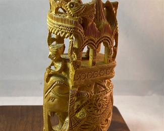 Lot 6100. $40.00. Intricate Wood Carved Elephant carrying riders in a two-tiered animal taxi. Probably meant for the tourist trade but it's very NICE. The two pointy turrets or whatever they are called on the top do remove for easier packing, and the whole unit is very interesting! 5"t x 2"w