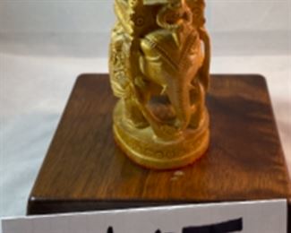 Lot 6100. $40.00. Intricate Wood Carved Elephant carrying riders in a two-tiered animal taxi. Probably meant for the tourist trade but it's very NICE. The two pointy turrets or whatever they are called on the top do remove for easier packing, and the whole unit is very interesting! 5"t x 2"w