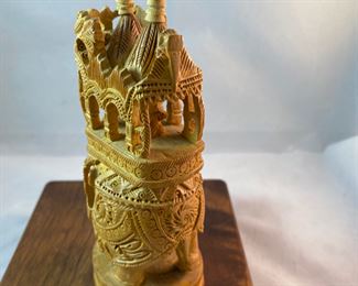 Lot 6100. $40.00. Intricate Wood Carved Elephant carrying riders in a two-tiered animal taxi. Probably meant for the tourist trade but it's very NICE. The two pointy turrets or whatever they are called on the top do remove for easier packing, and the whole unit is very interesting! 5"t x 2"w