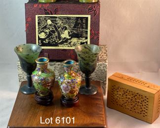 Lot 6101. $48.00 8 pretty trinkets with an Asian theme: 2 cloissoné mini vases on stands (2"tx1.5"w), 2 stone goblets with silk box (2" x 1.5"dia), a hinged cut box about 3"x2", (I believe this is a cricket box - catch a cricket, put in box and you will have good luck) 2 jadeite cups with gift box, sailboat pendant/pin with small box (1.5"t x 1"w)