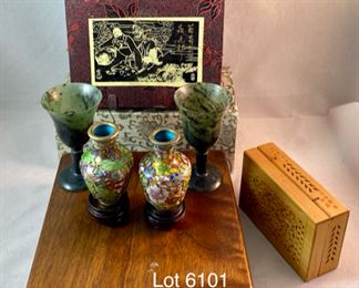 Lot 6101. $48.00 8 pretty trinkets with an Asian theme: 2 cloissoné mini vases on stands (2"tx1.5"w), 2 stone goblets with silk box (2" x 1.5"dia), a hinged cut box about 3"x2", (I believe this is a cricket box - catch a cricket, put in a box and you will have good luck) 2 jadeite cups with gift box, sailboat pendant/pin with a small box (1.5"t x 1"w)