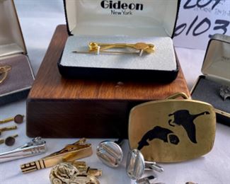 Lot 6103. $48.00 Lot of 11 pieces of nice men's jewelry:
Elk Tie stud sterling, Trout and Geese Brass belt buckle, Gideon Tie Clip & pin, Krementz gold filled men's jewelry, 3 pr of men's cuff links, 1 Krementz money clip. I Still think Krementz is one fine costume jewelry maker - most of their items are gold-filled but very classy looking.