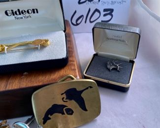 Lot 6103. $48.00 Lot of 11 pieces of nice men's jewelry:
Elk Tie stud sterling, Trout and Geese Brass belt buckle, Gideon Tie Clip & pin, Krementz gold filled men's jewelry, 3 pr of men's cuff links, 1 Krementz money clip. I Still think Krementz is one fine costume jewelry maker - most of their items are gold-filled but very classy looking.